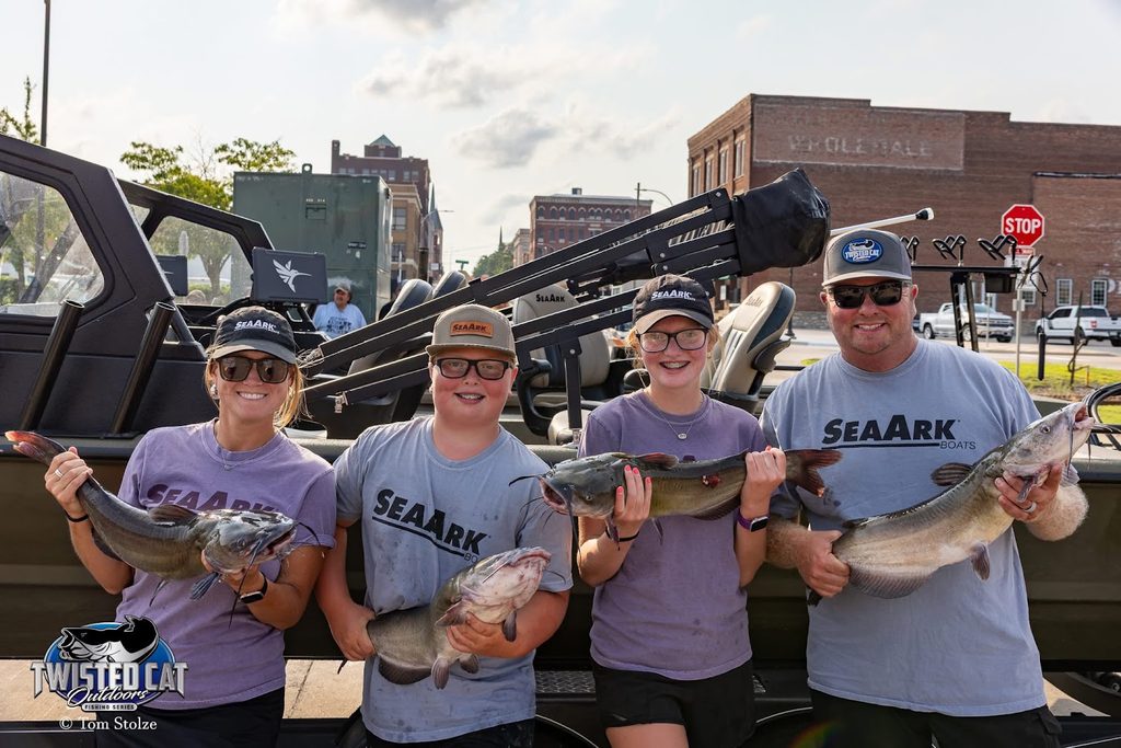 Team Moore Outdoors family holding fish